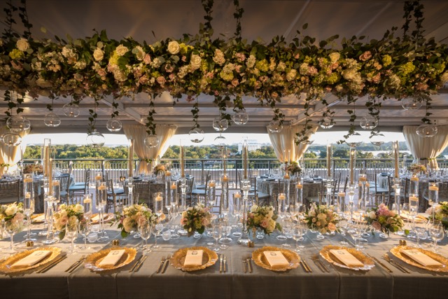 Rooftop tent reception with a suspended floral installation